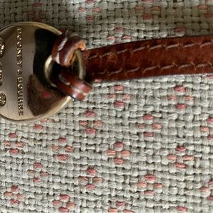 Dooney and Bourke signature logo hang leather logo